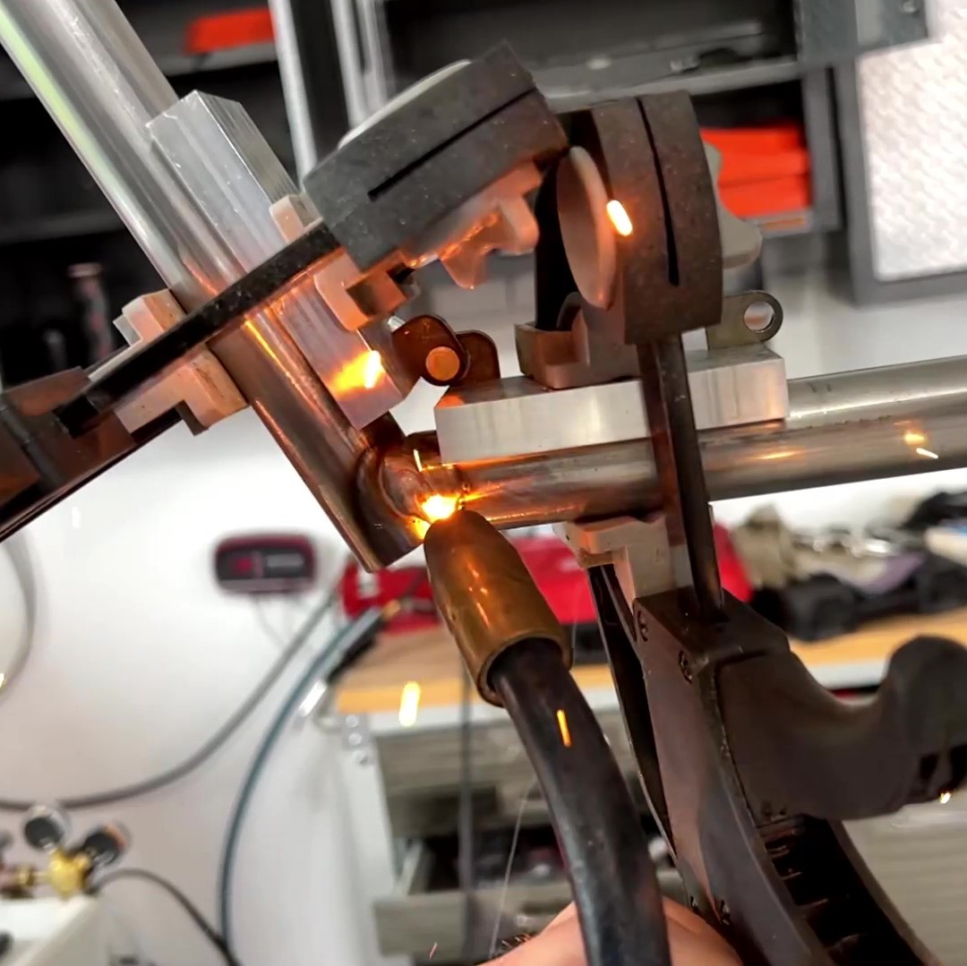 TIG welding with live sparks on a custom fabricated part